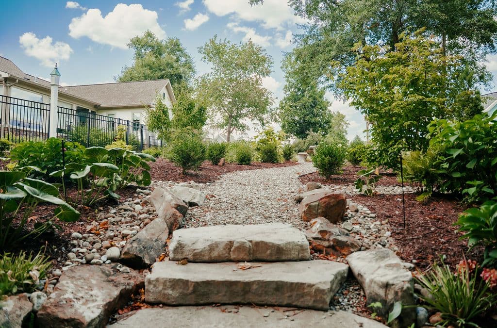 Natural stone steps set into a landscaped slope.