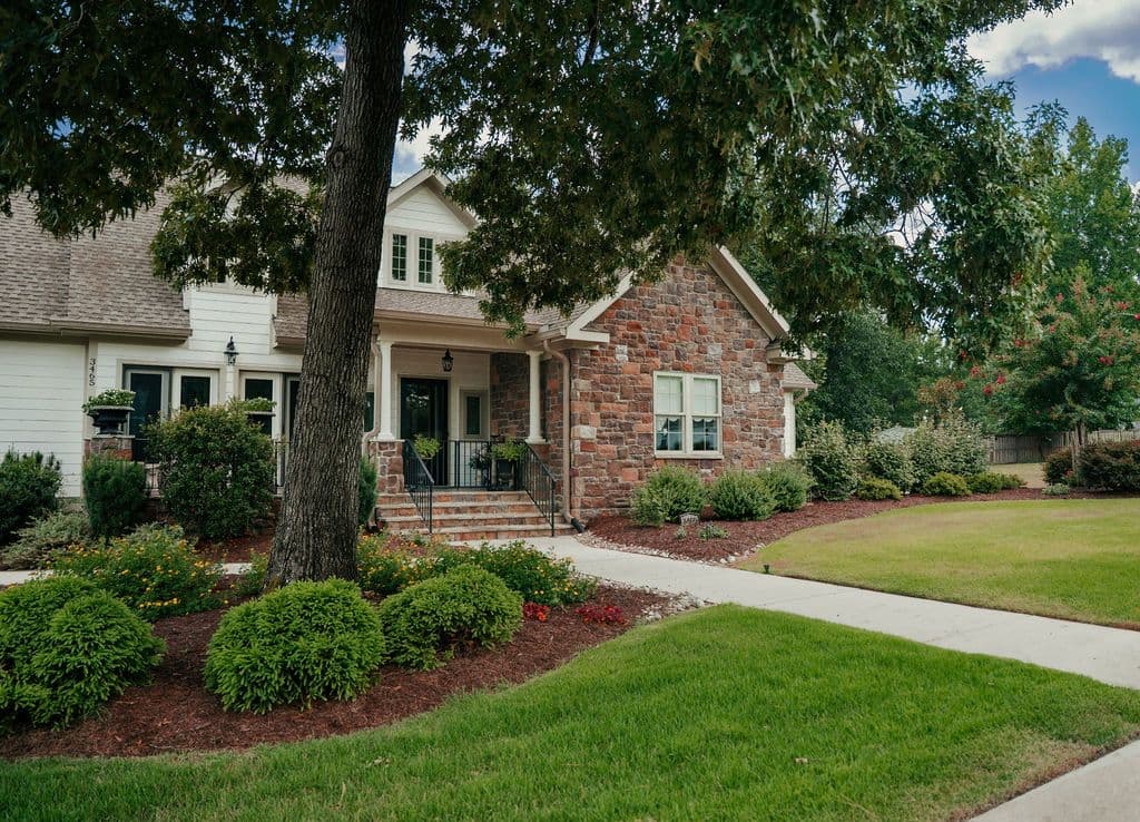 A foundation planting bed wrapping a brick home.