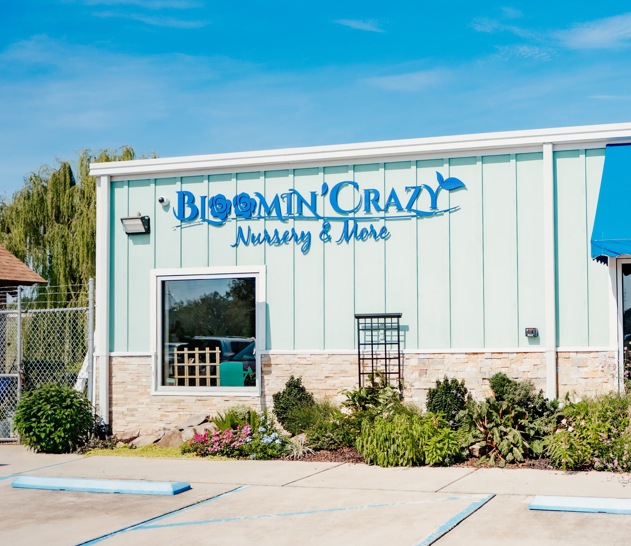 The Bloomin' Crazy Nursery & More storefront on a clear day.